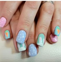 Pastel gel nail art on client's hand